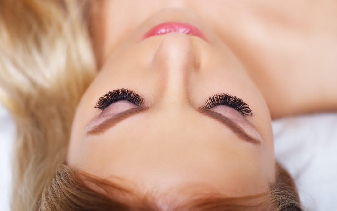 Beauty makeup for blue eyes. Part of beautiful face closeup. Perfect skin, long eyelashes, make up